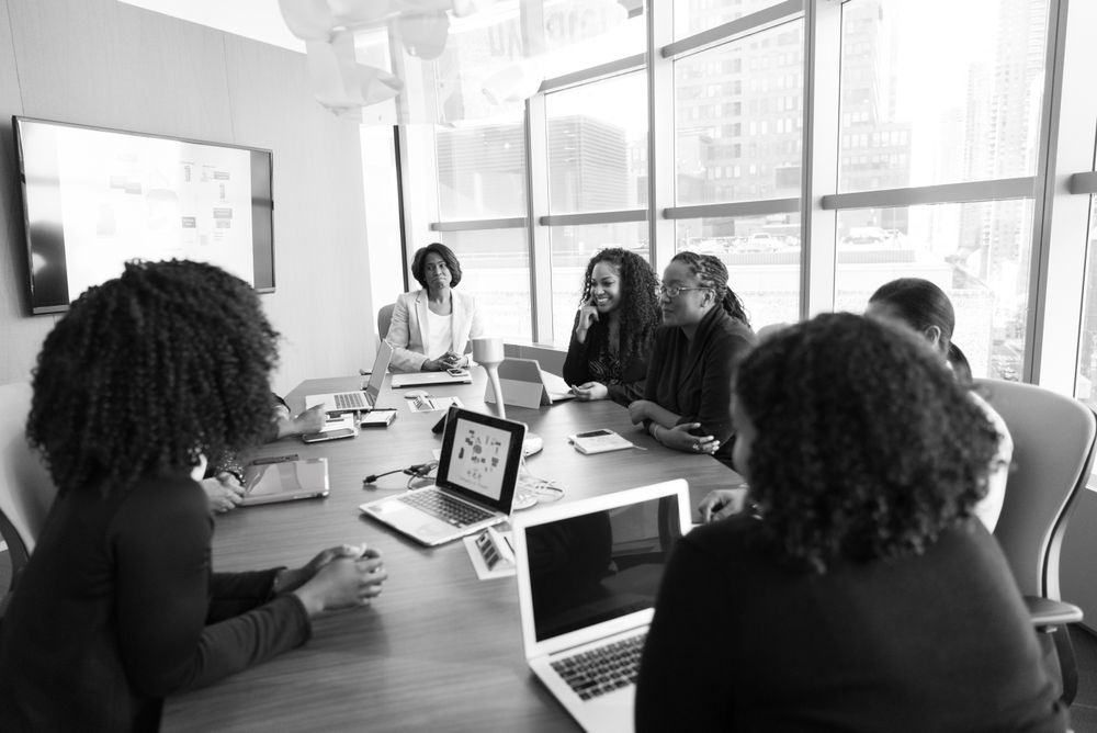 Professionals sharing ideas around a meeting table